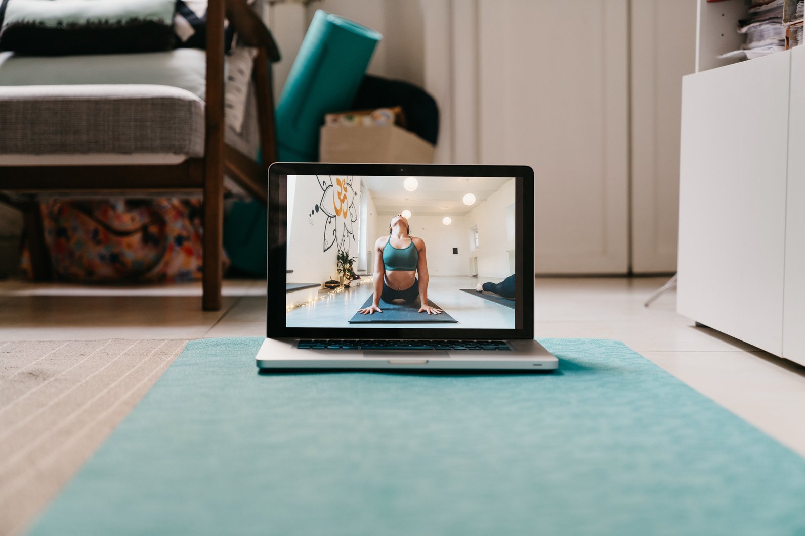 The laptop is ready for an online yoga video lesson